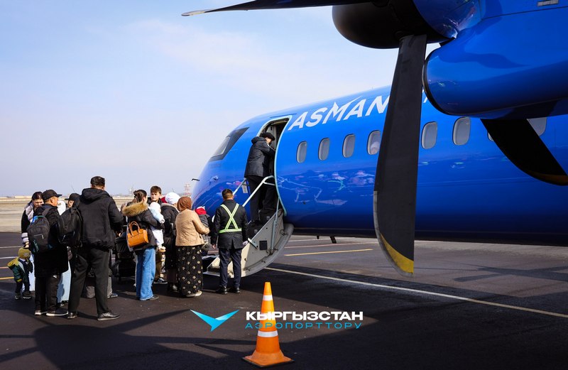 Kyrgyzstan’s Asman Airlines regional aircraft; passengers boarding